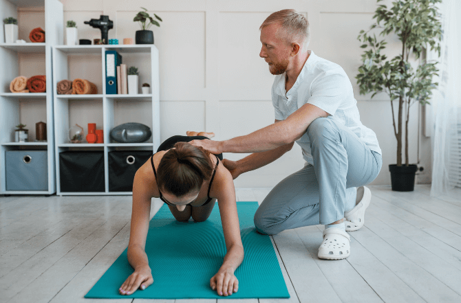 Movement Coaching therapist guiding a client through functional exercises